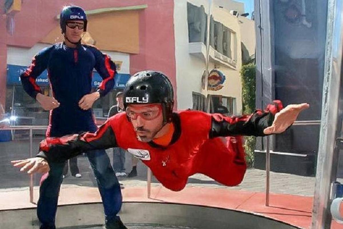 a man is doing a trick on a trampoline