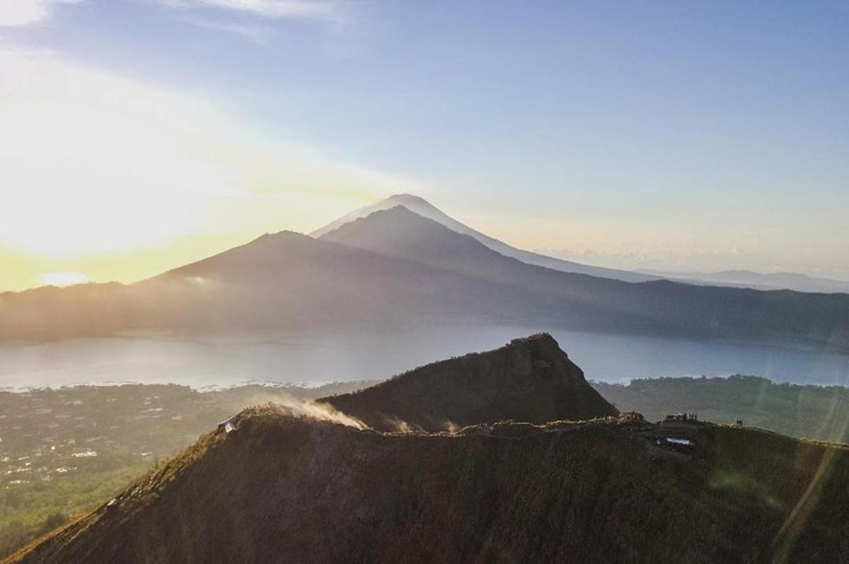 a mountain with a view of a body of water