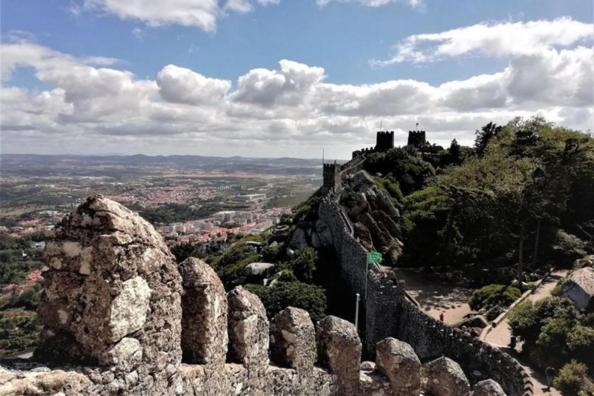 a view of a castle on top of a mountain