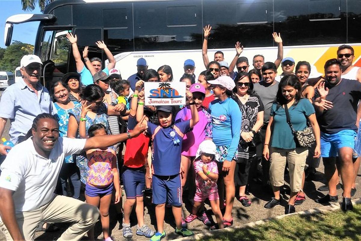 a group of people standing in front of a bus