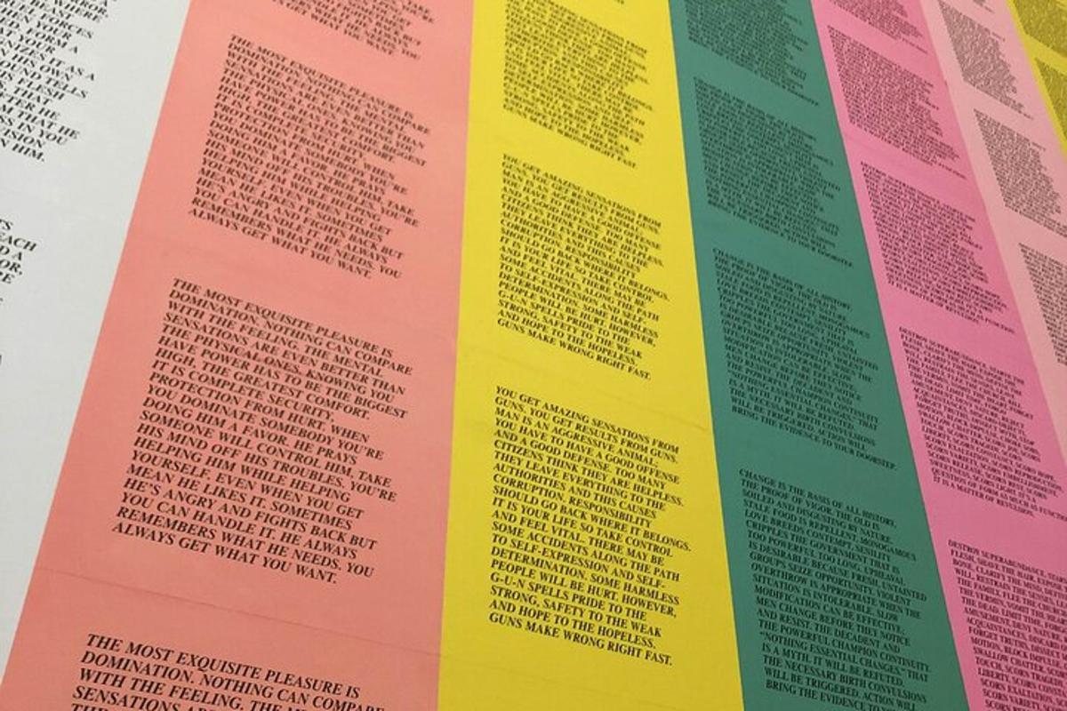 a stack of different colored paper