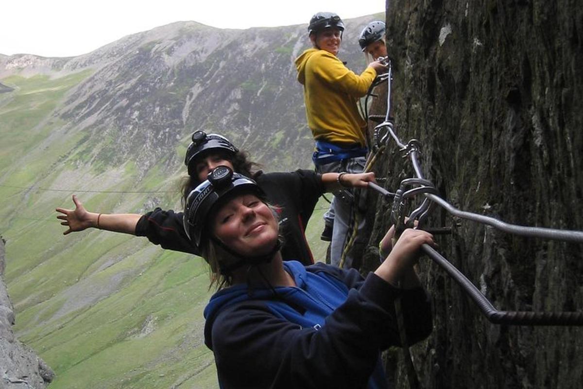 a group of people climbing on a mountain
