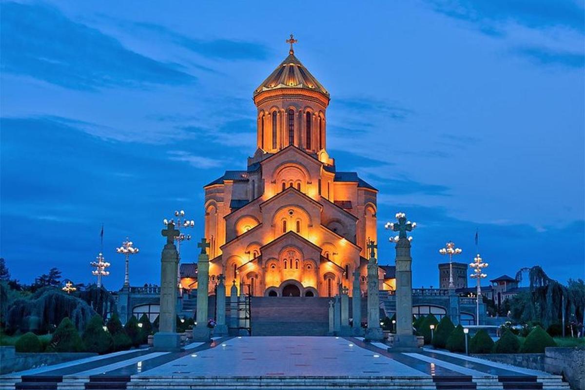 a church with a tower at night