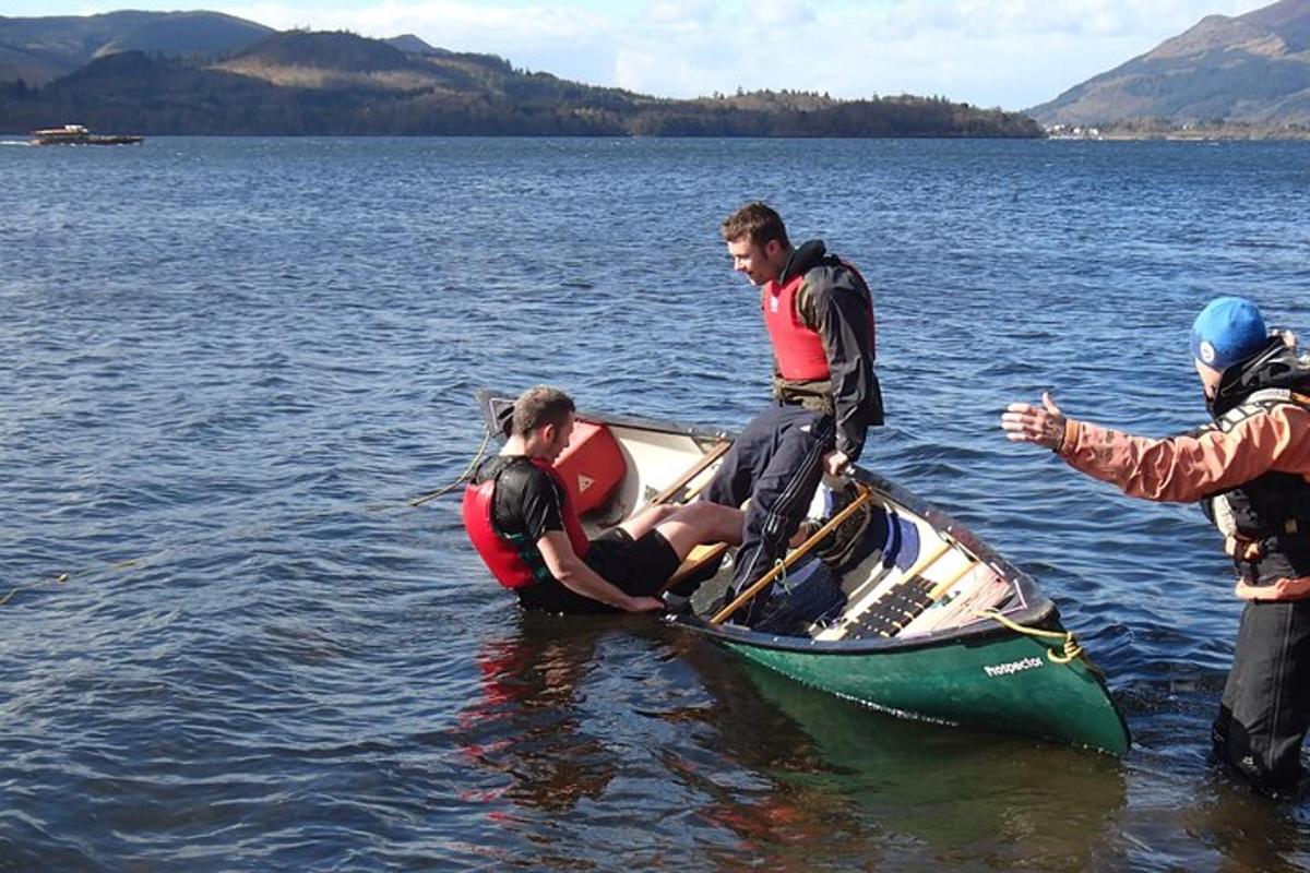 a group of people in a canoe in the water