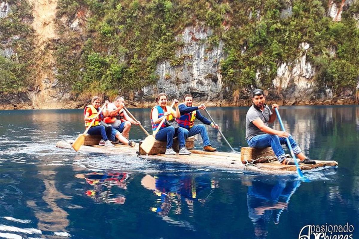 a group of people on a raft in the water