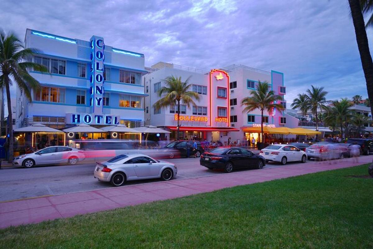 a group of cars parked in front of a hotel