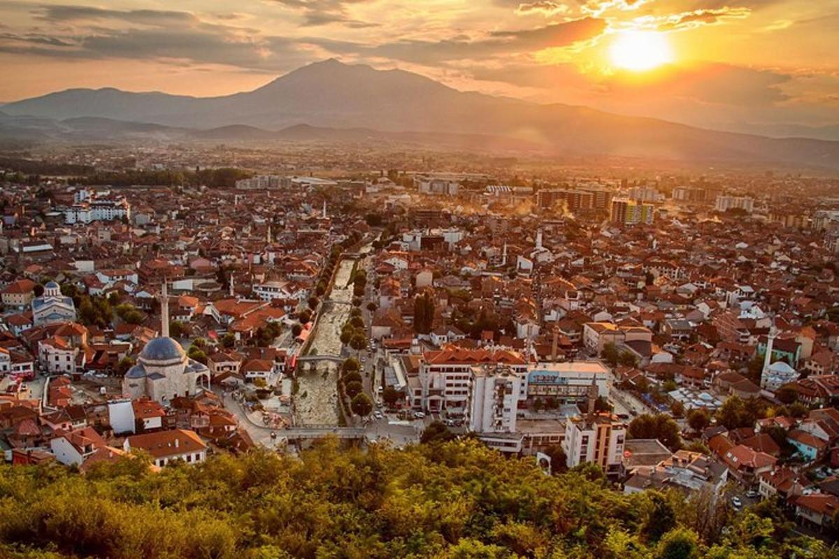 an aerial view of a city at sunset