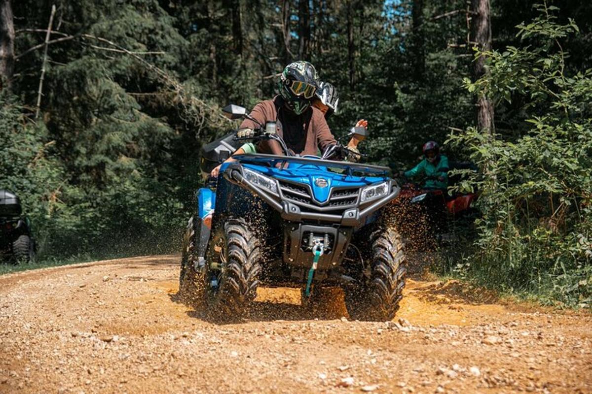 a person riding a atv on a dirt road