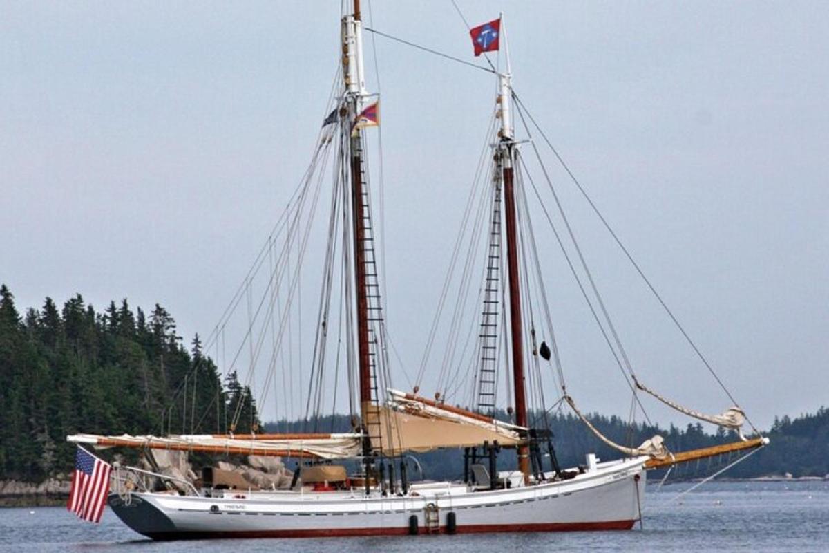 a boat with an american flag on the water
