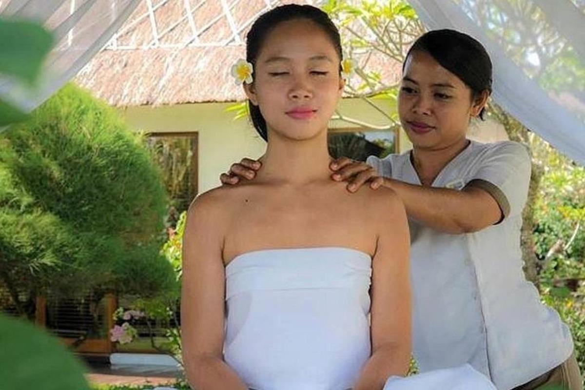 a man standing next to a girl in a wedding dress