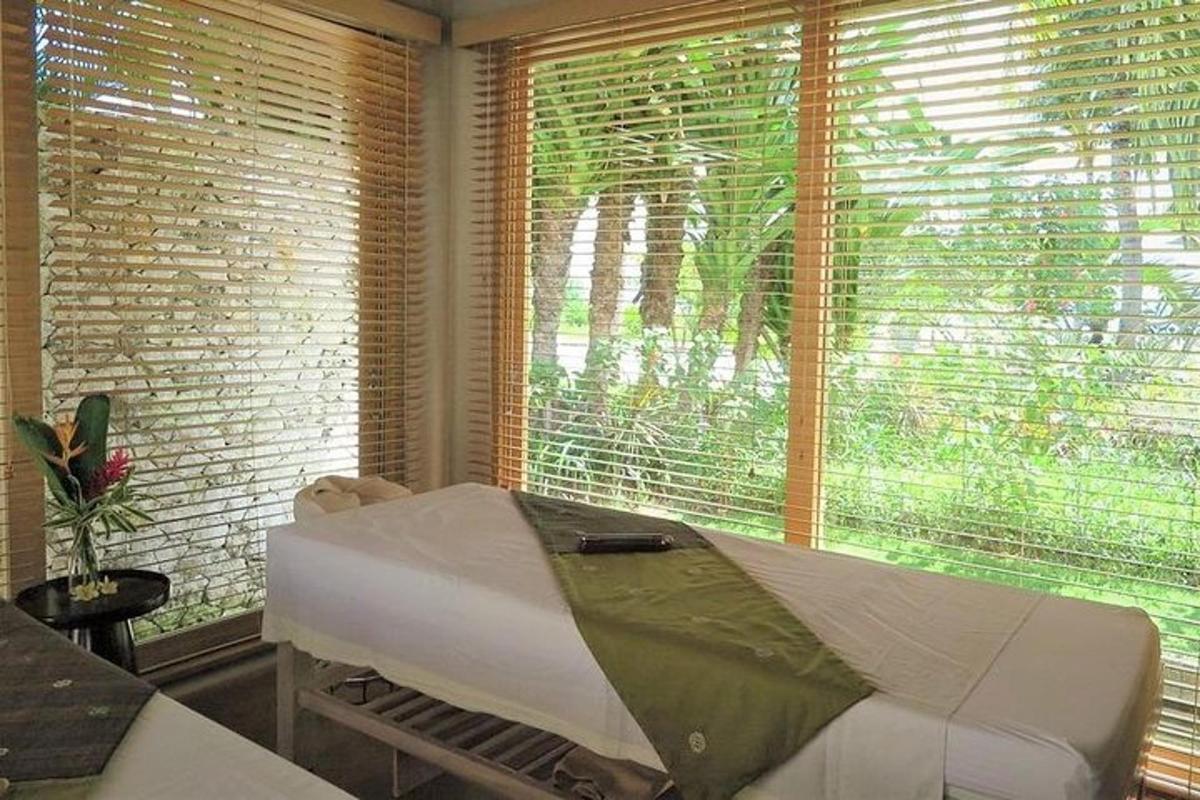 a room with a bed and a large window