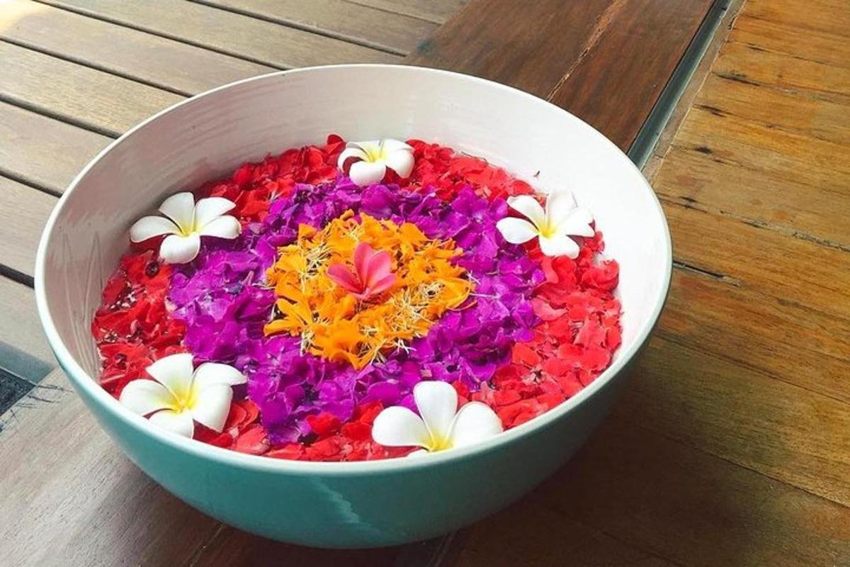 a bowl filled with flowers in a bowl on a table