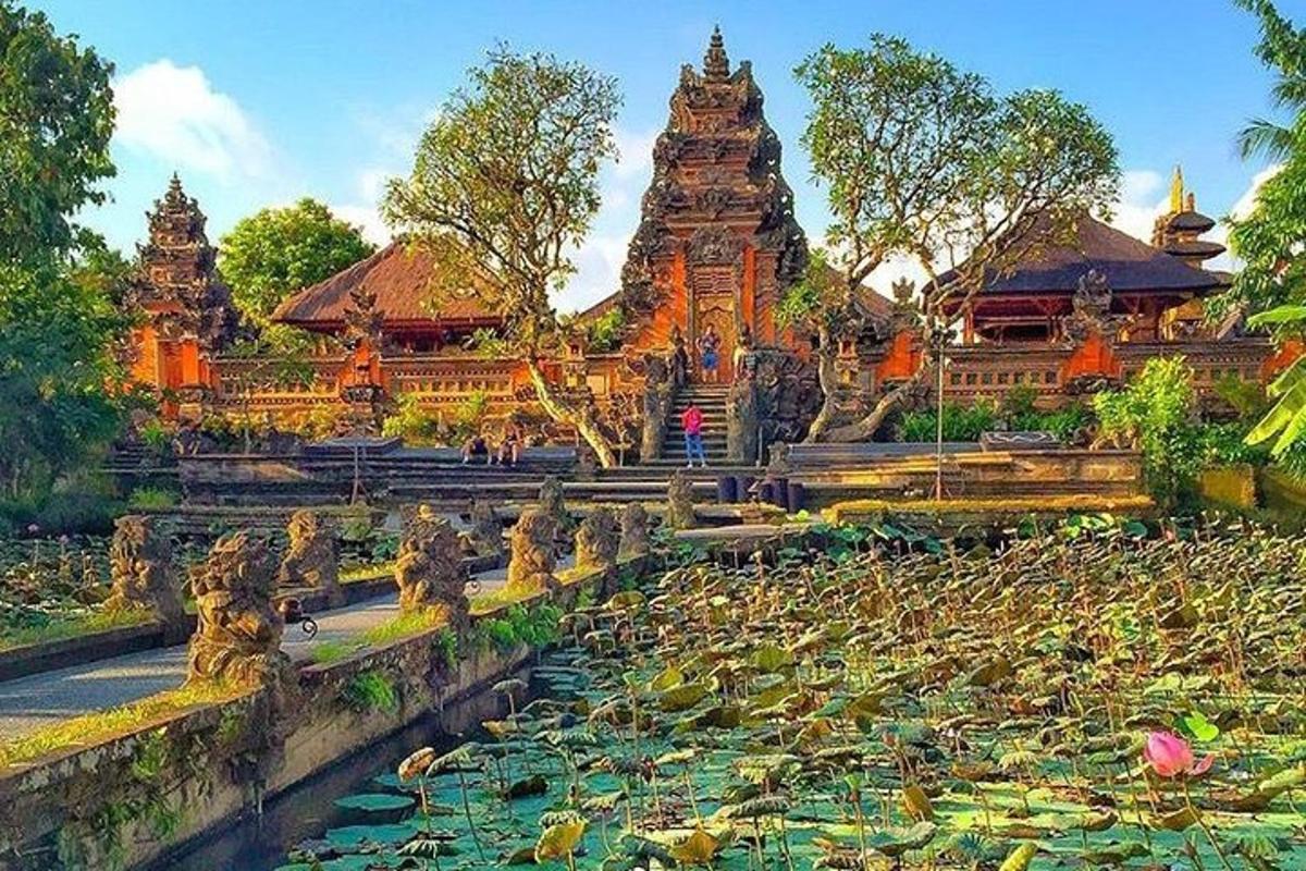 a temple with a pond in front of it
