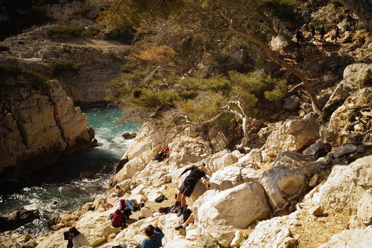 a group of people climbing up a rocky mountain