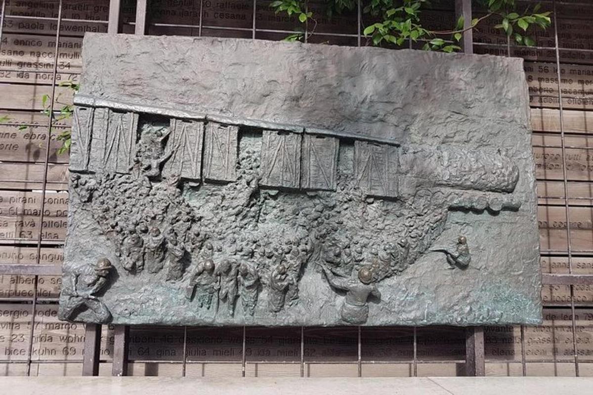 a stone statue of a ship on a wall