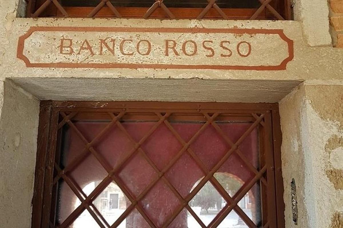 a door to a building with a sign above it