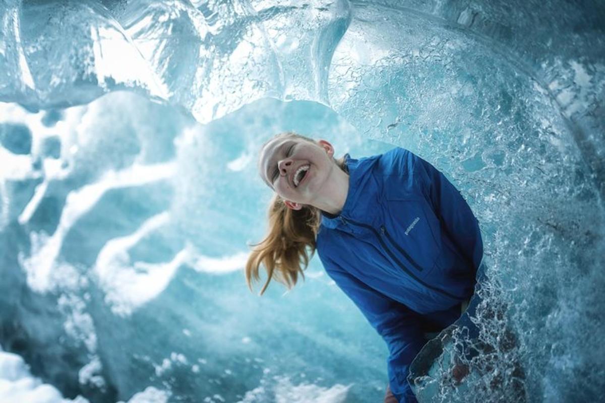 a woman standing in front of an ice sculpture