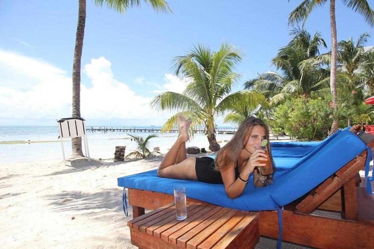 a woman laying on a raft on the beach