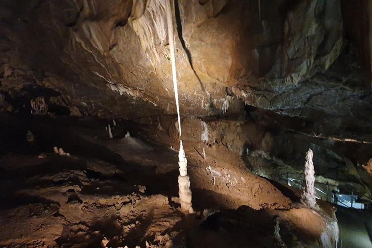 a cave with a rope hanging from the ceiling