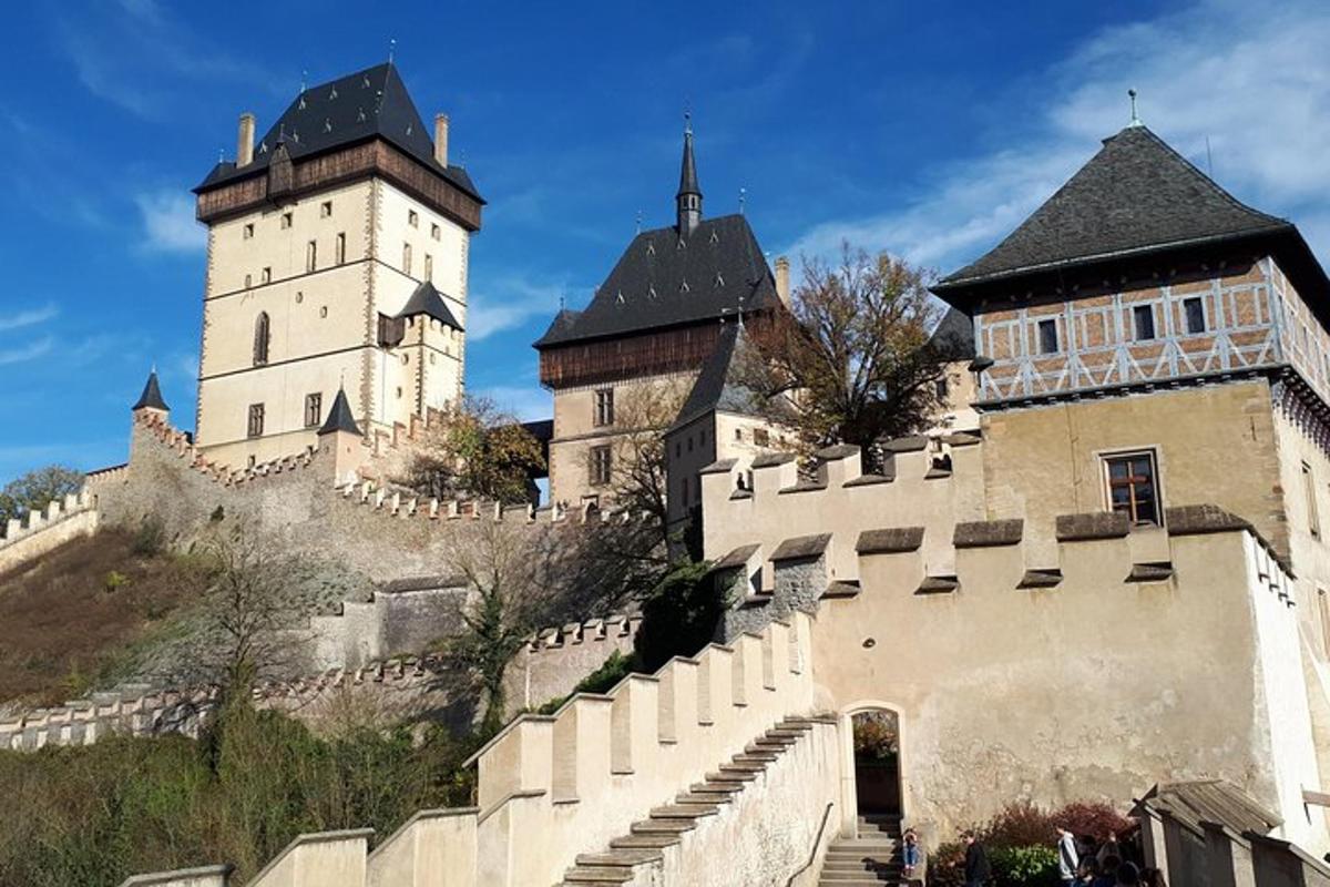 a castle with two towers on top of a hill