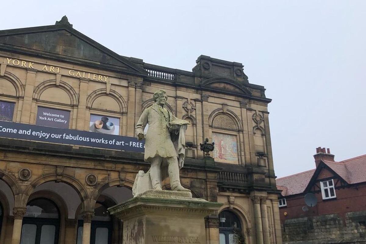 a statue of a man in front of a building