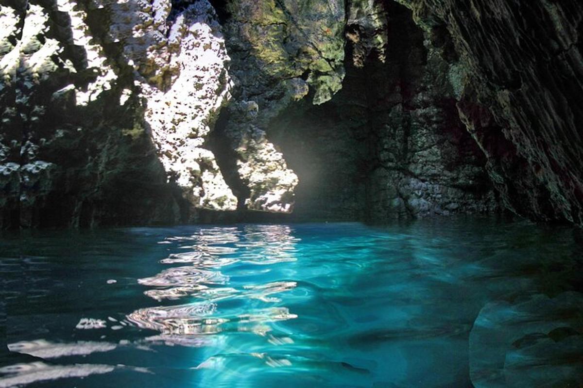 a pool of blue water in a cave
