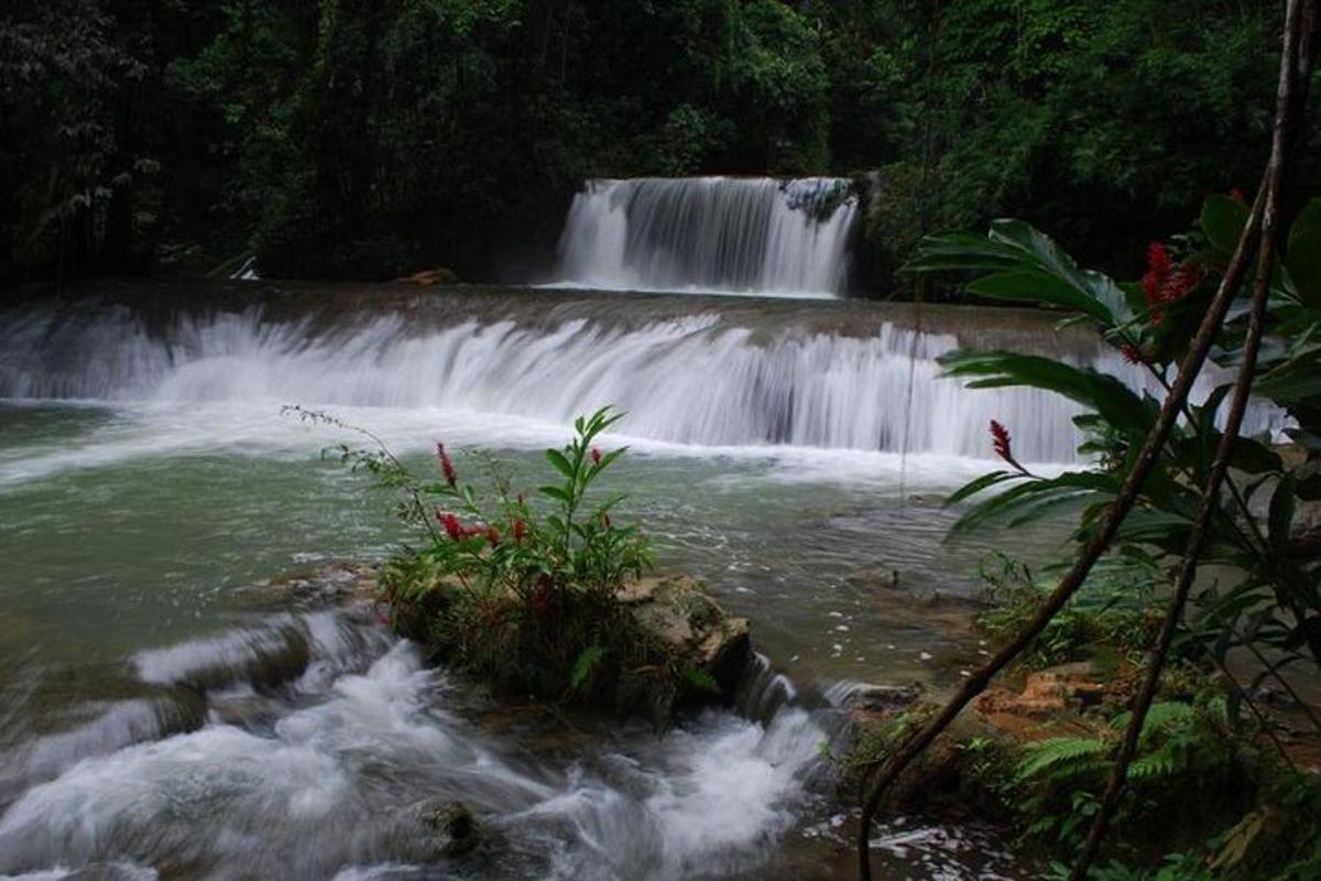 a waterfall in the middle of a river