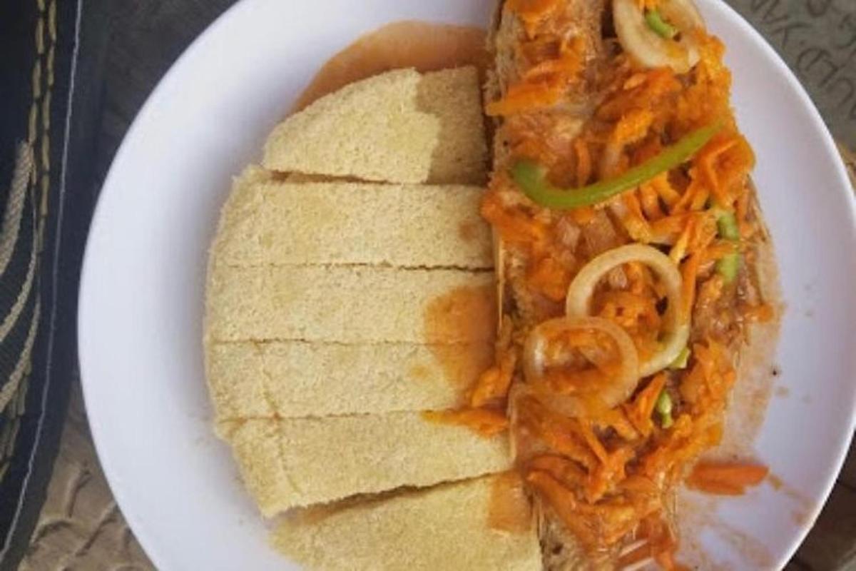 a plate of food with a sandwich and bread