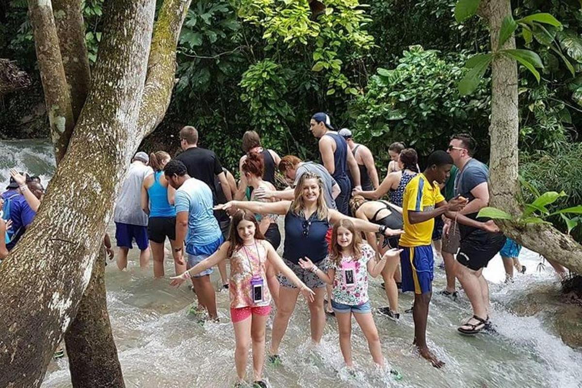 a group of people standing in the water