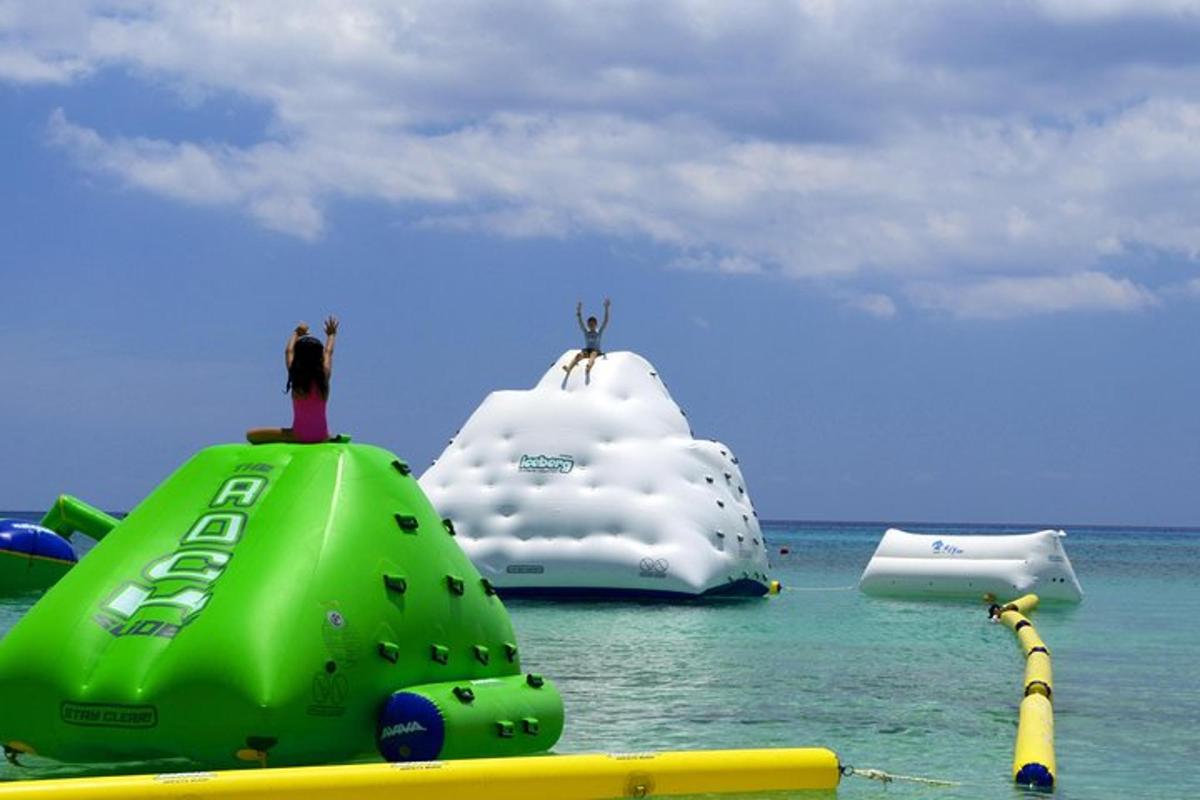 a group of inflatable objects in the water