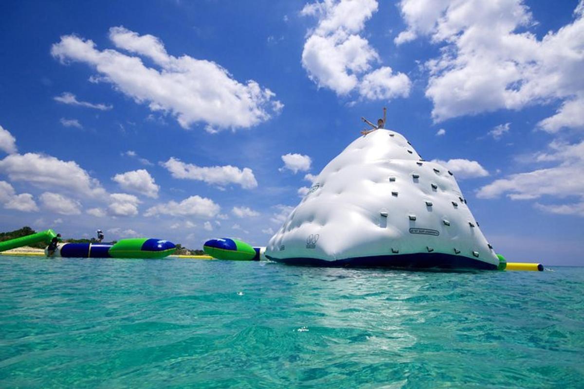 a group of inflatable water slides in the ocean
