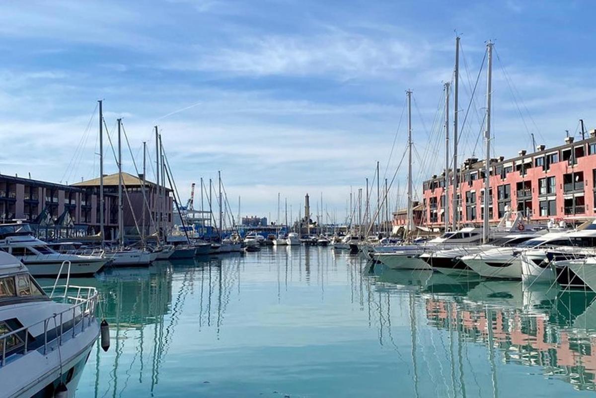 a group of boats docked in a harbor with buildings