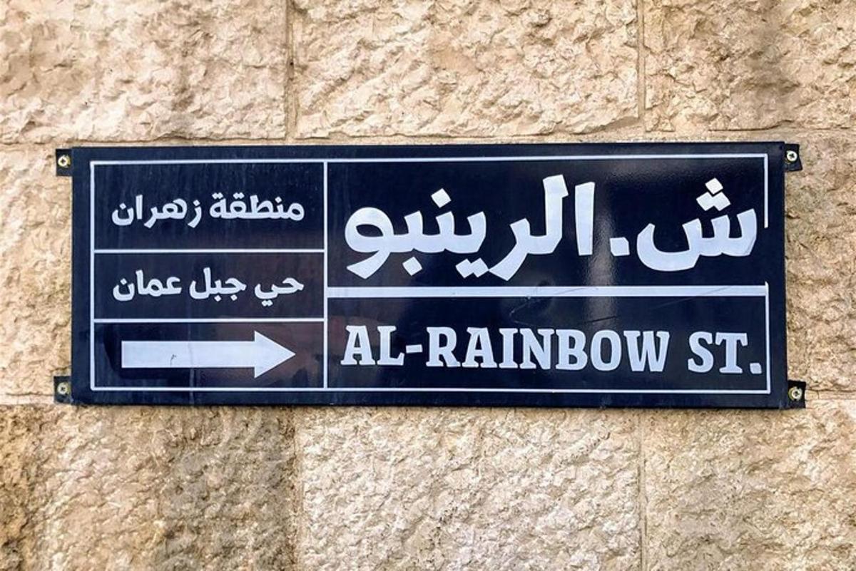 a street sign on the side of a building