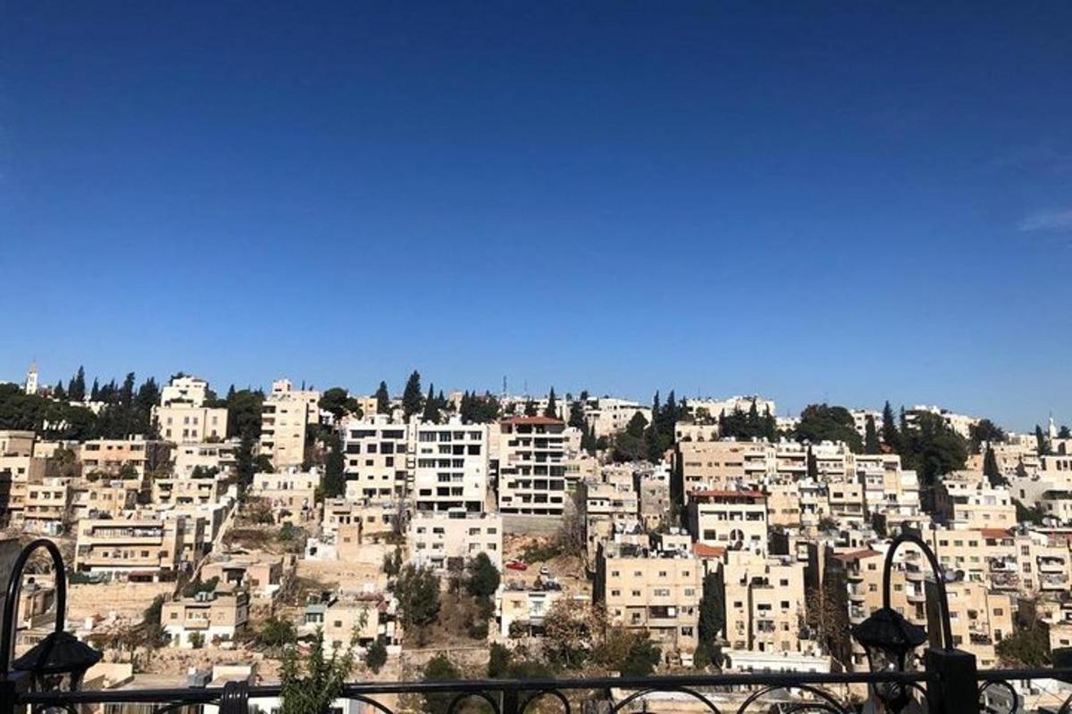a view of a city with buildings on a hill