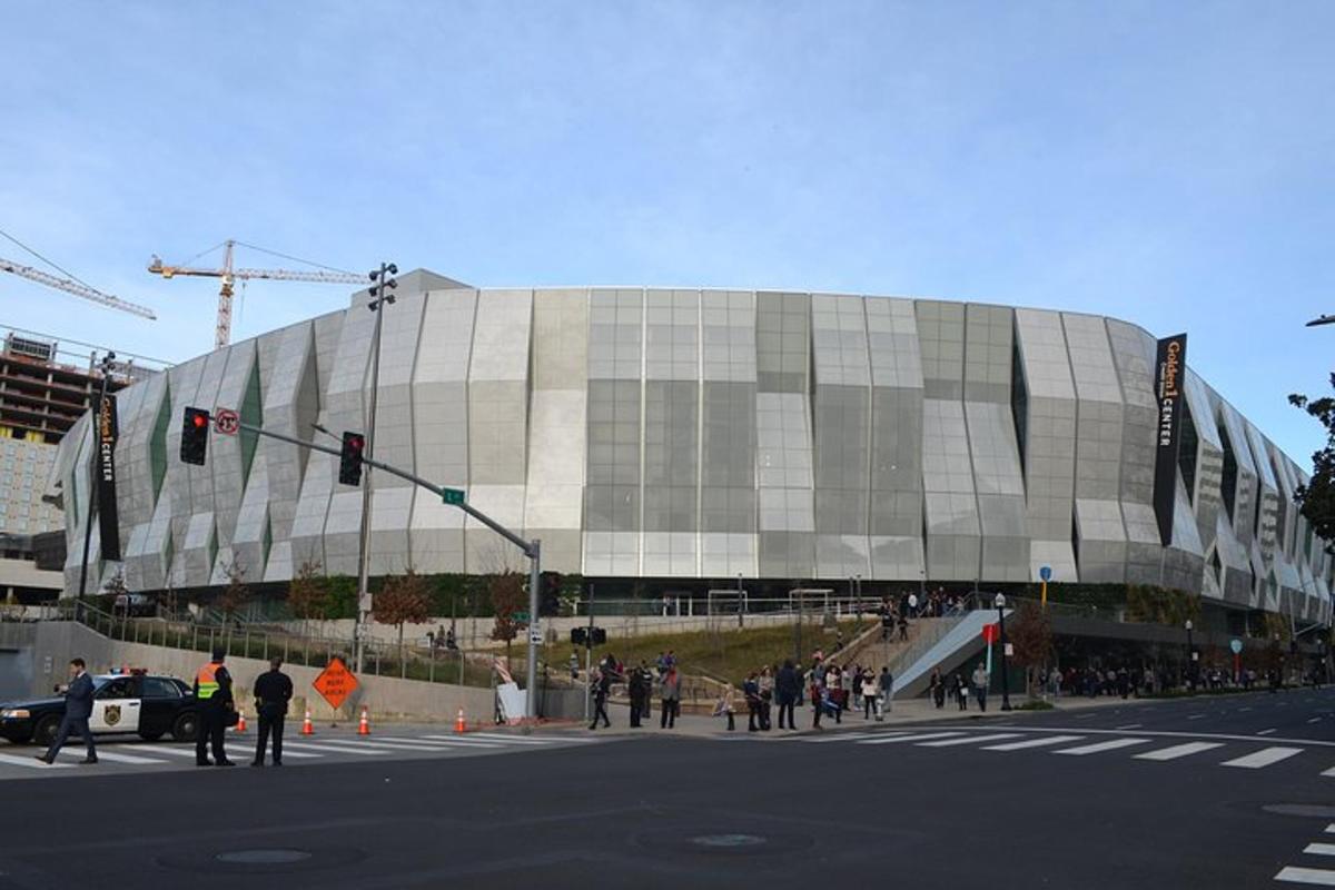 a large building with people standing outside of it