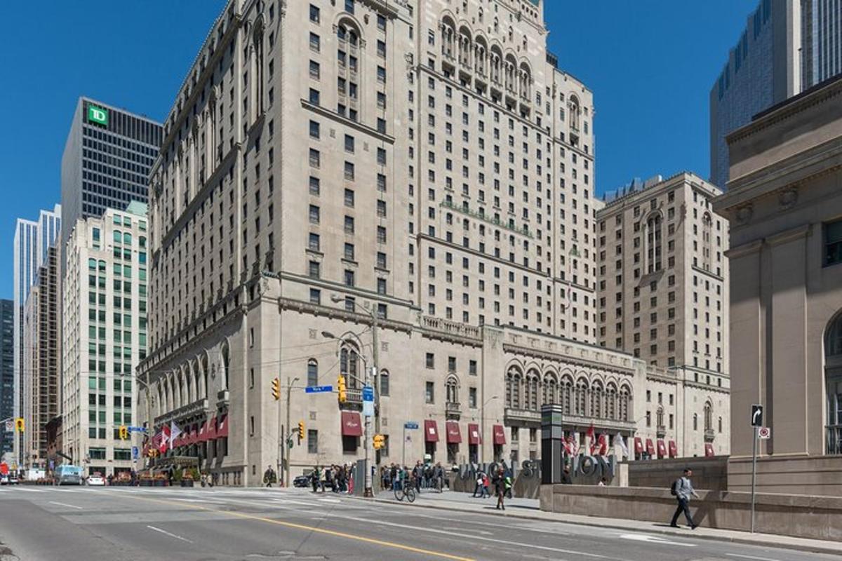 a city street with tall buildings in a city