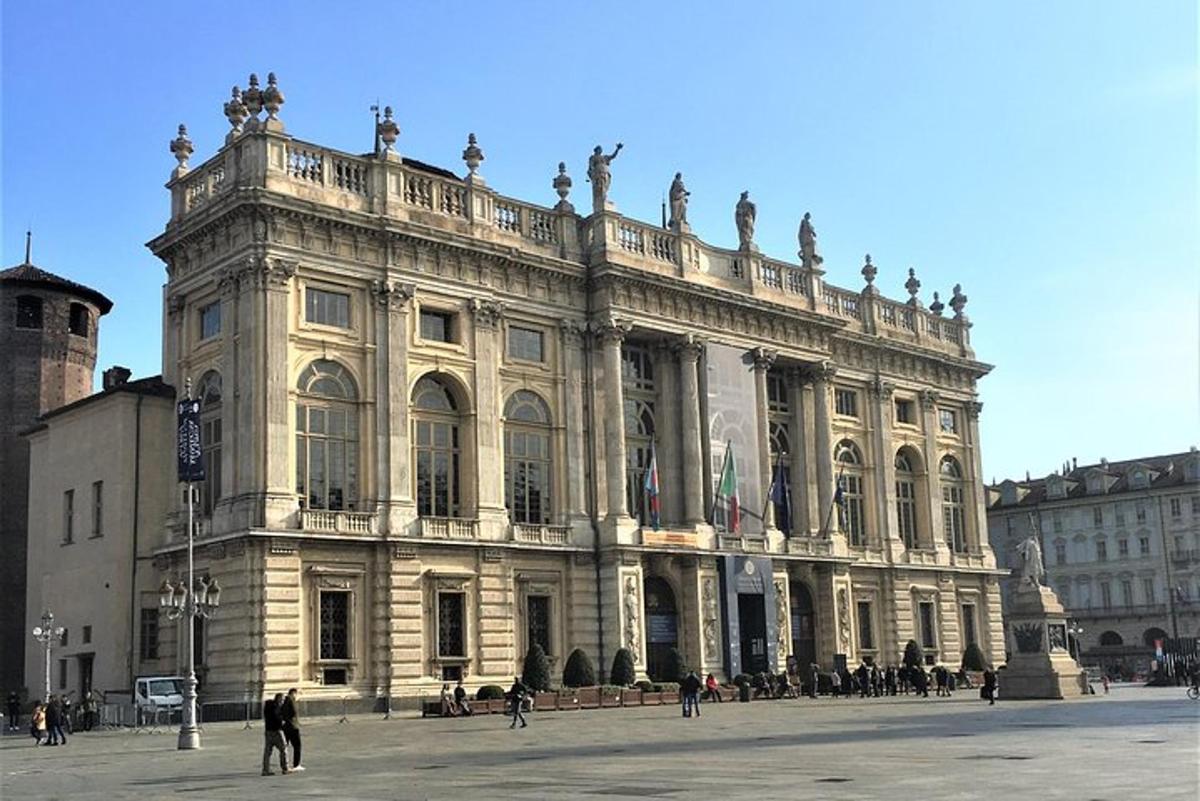 a large building with people walking in front of it