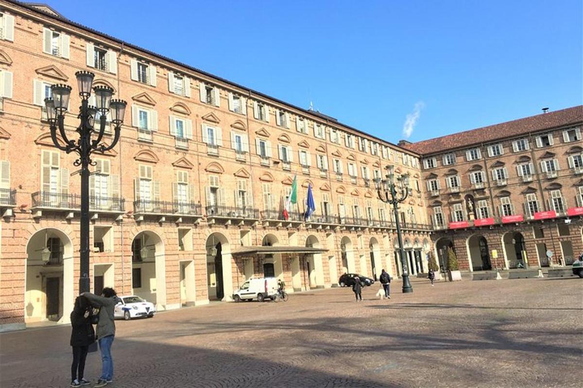 a large building with people standing in front of it