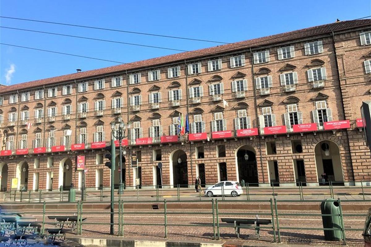 a large brick building with a car in front of it