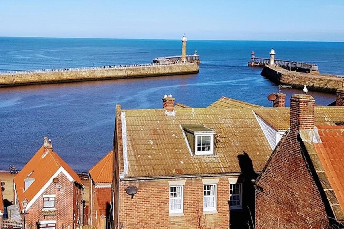 a view of a building and the ocean and a pier