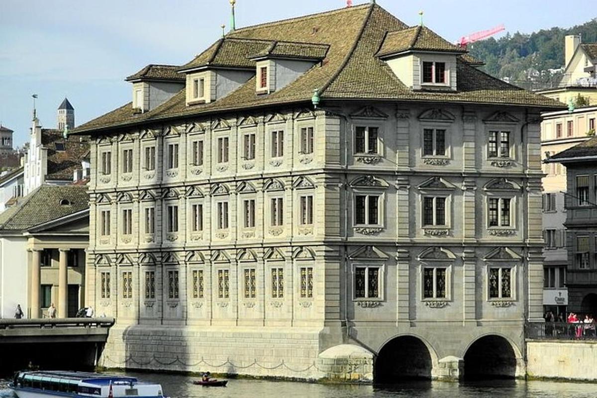 a large building on the water next to a river