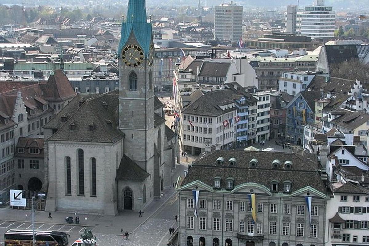 a large church with a clock tower in a city