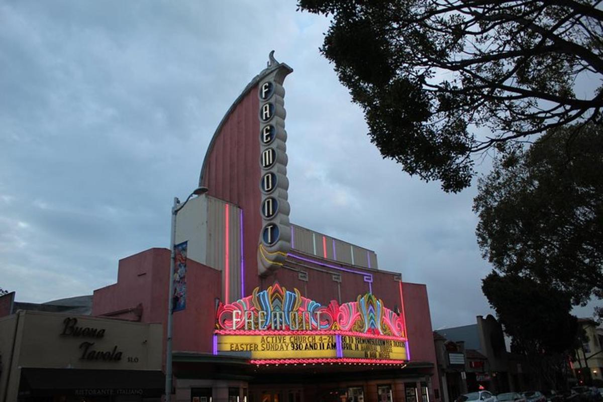 a large building with a neon sign on it