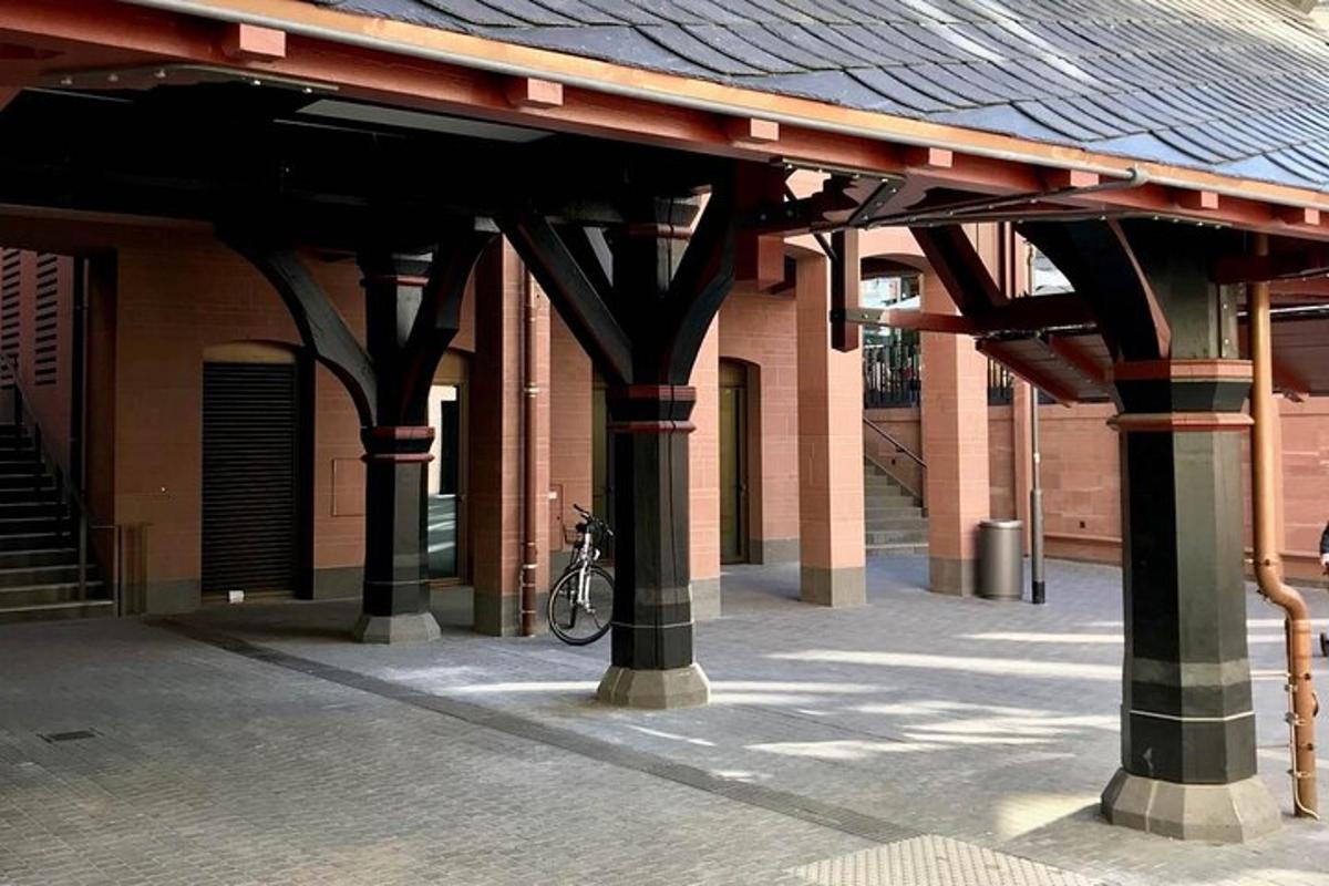 a building with columns and a bike under a roof