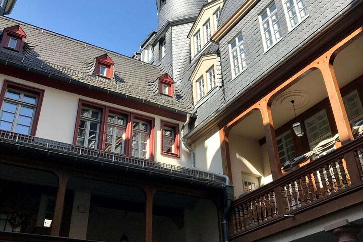 a group of buildings with balconies and a tower