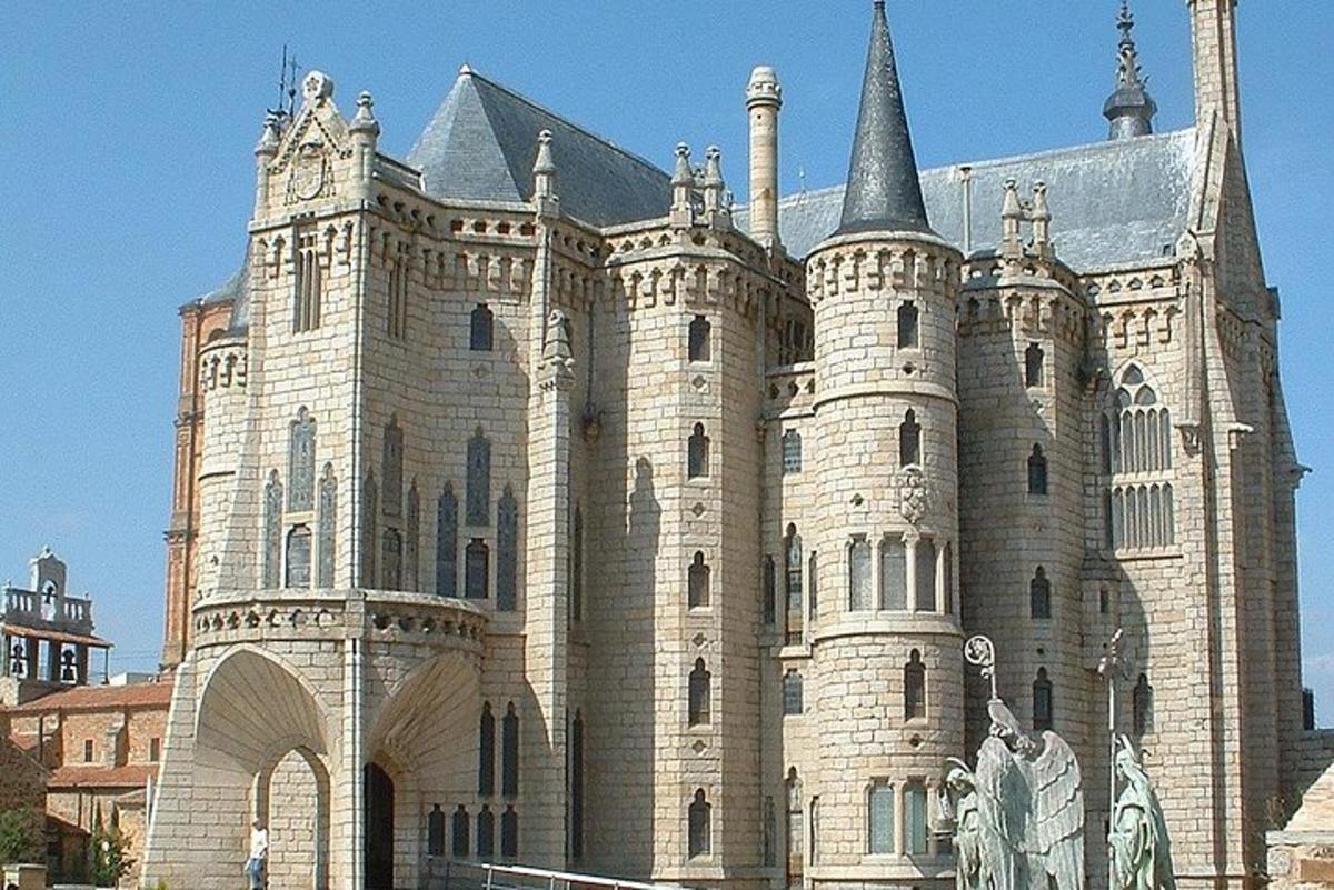 a large castle building with a statue in front of it