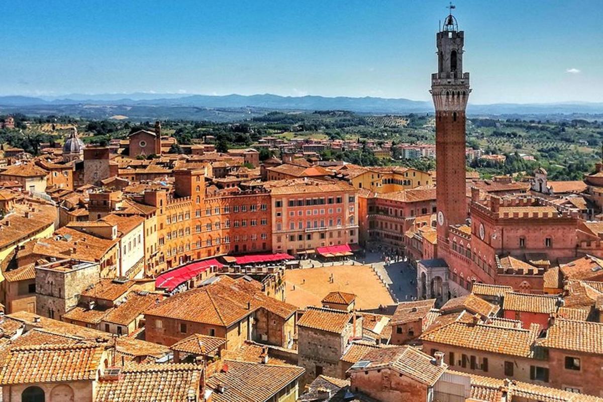 an aerial view of a city with a clock tower