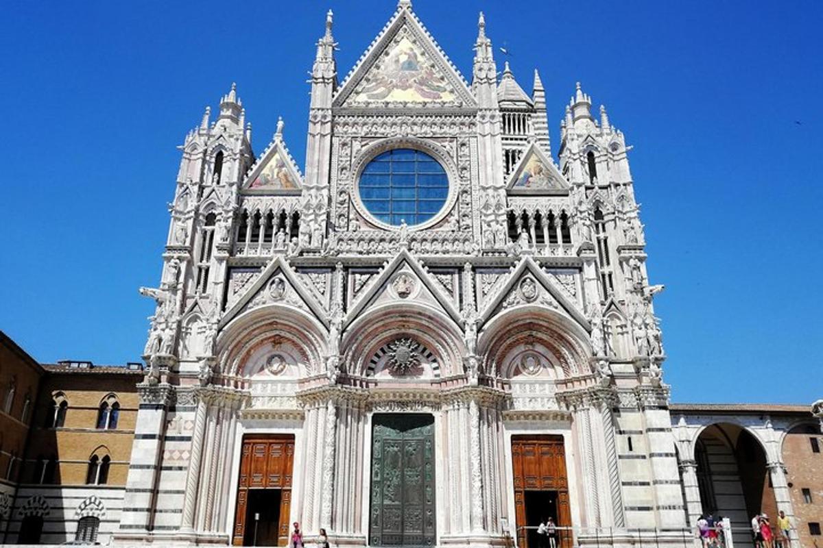 a large white cathedral building with a blue sky