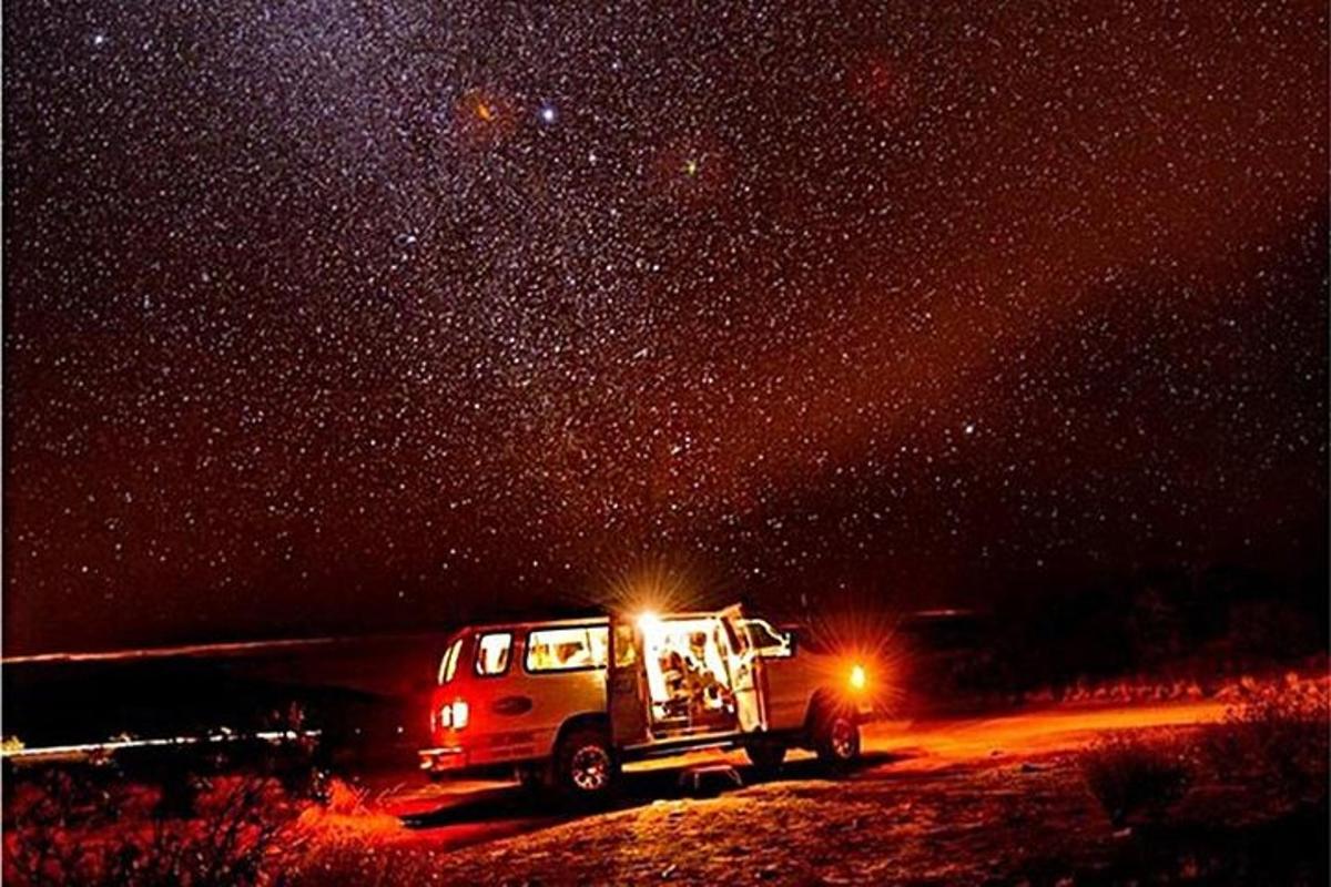 a van parked under a starry sky at night