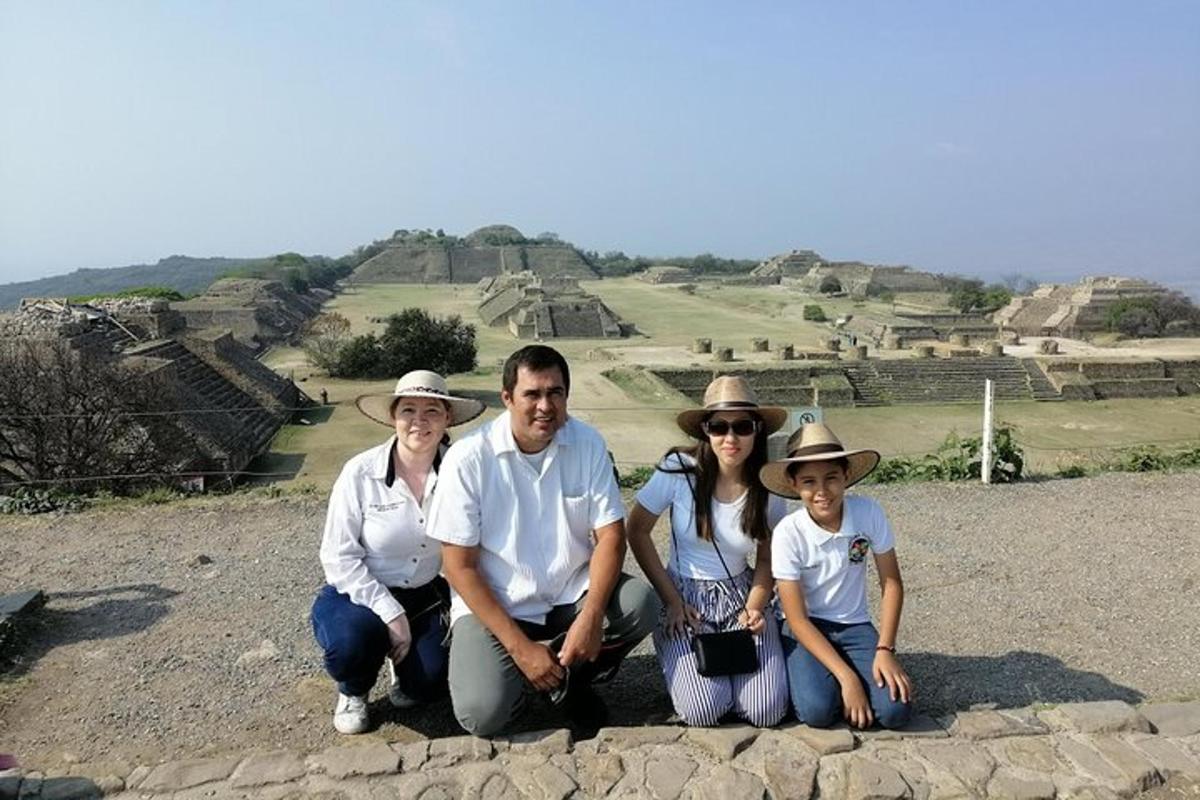 a family posing for a picture at the pyramids